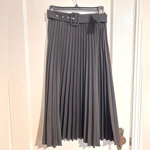 Long black pleated skirt with belt